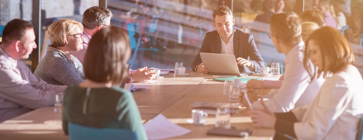 Conceptual meeting image (stock photo) representing Almanac Realty Investors and Asia Capital Real Estate teams coordinating around the $320 million equity commitment to support ACRE’s multifamily debt and property investment activity announced June 11, 2026.