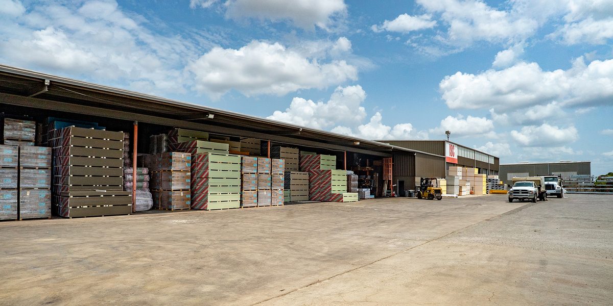 The industrial warehouse and outdoor storage yard at 8799 Crownhill Blvd. illustrate the 53,100-square-foot San Antonio IOS facility acquired by Apricus Realty Capital and ABR Capital Partners.