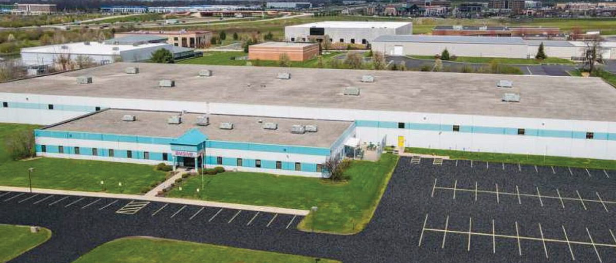 An aerial view of the 140,000-square-foot industrial facility at 3303 W Tech Rd in Dayton’s Springboro South submarket, acquired by Brennan Investment Group and leased to Killer Brownie.