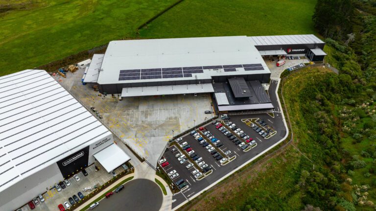 Aerial view of 78 Tidal Road, Māngere, Auckland, an industrial asset in the Centuria NZ Industrial Fund, showing roof-mounted solar panels and site infrastructure; this is one of the properties targeted by the fund’s $117 million of APLMA‑aligned green loans to support qualifying sustainability upgrades.
