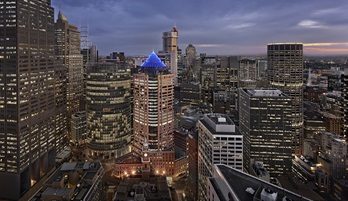 An aerial view of Melbourne's CBD provides location context for 111 Bourke Street, where Charter Hall and BGRE have secured leases taking the office tower to 95% occupancy.