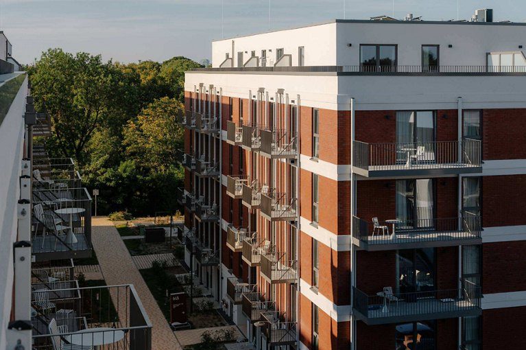 Momento Berlin's residential buildings in Neukölln, the newly opened 758-home rental community developed by Greystar with Bauwens.