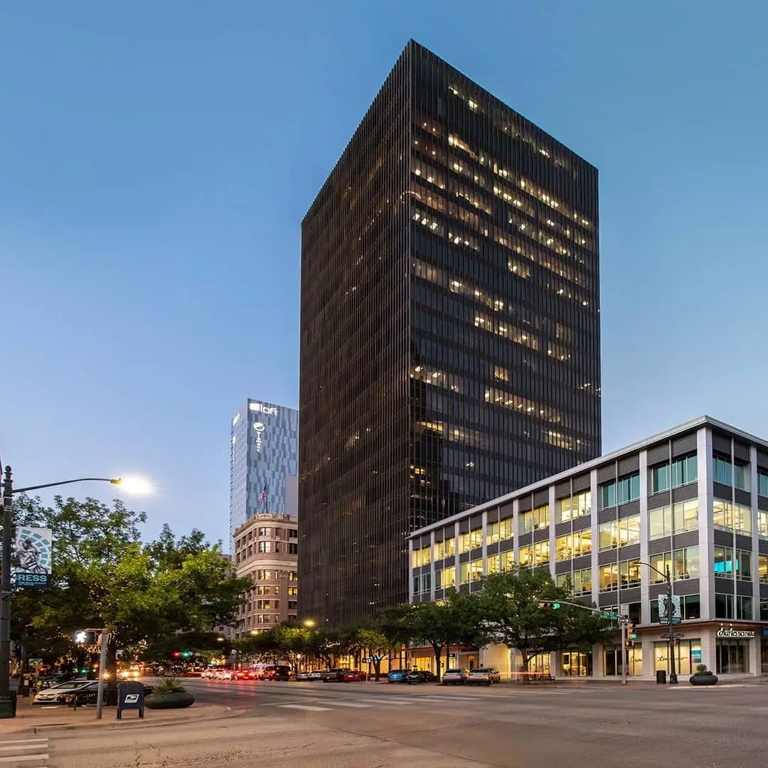 515 Congress, KBS's 26-story Class A office tower in downtown Austin, is shown illuminated at dusk following its sale to AQUILA, Palmatum Ventures and Glendon Capital Management.