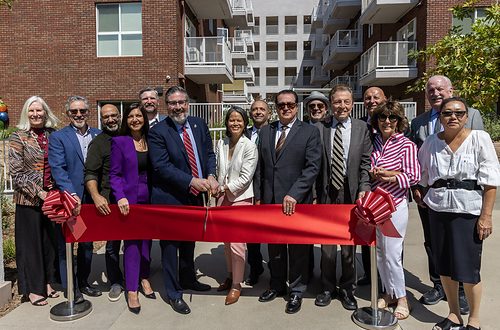 Glendale Mayor Ardy Kassakhian and Linc Housing's Suny Lay Chang join National CORE, CalHFA, city officials and new residents at the ribbon cutting for Pioneer Village, the 340-unit affordable housing community in Glendale.