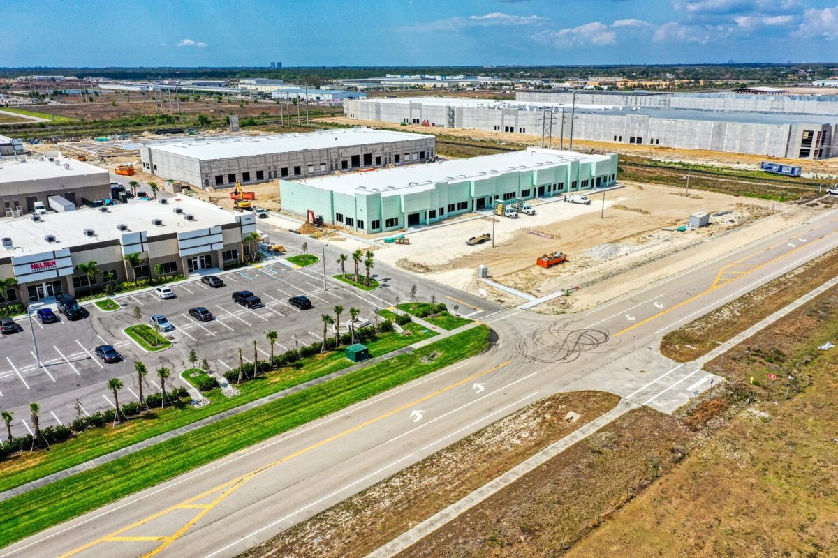 Aerial view of commercial parcels near State Road 82 and Parkdale Blvd in Lehigh Acres, the 24-acre land assemblage LSI Cos. brokered for $6 million to MCIN Bell, illustrating the site's commercial development potential.