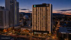 The downtown Reno hotel pictured is the landmark property Madison Capital Group’s Madison Reno Hotel QOF aims to reposition, the former Harrah’s Resort and Casino slated for conversion into a roughly 292‑room Class A hospitality destination under the $36.2 million fund.