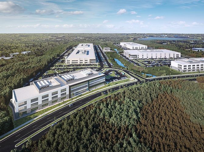Aerial 3D rendering of the Pathway Triangle life-sciences campus in Morrisville, N.C., showing multiple modern lab/manufacturing buildings, roadways, parking areas and landscaping.