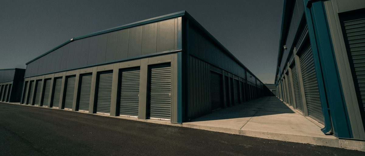 Exterior view of single-story roll-up units consistent with Murrells Inlet Storage, the 590-unit, 79,300‑square‑foot climate‑controlled self-storage facility recently acquired by Reframe Holdings and rebranded to Public Storage.