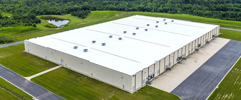 An aerial view of a modern warehouse at Richmond Trade Center in Chester, Virginia, the 1.03 million-square-foot industrial campus acquired by Rockpoint Group and Rockpoint Industrial.