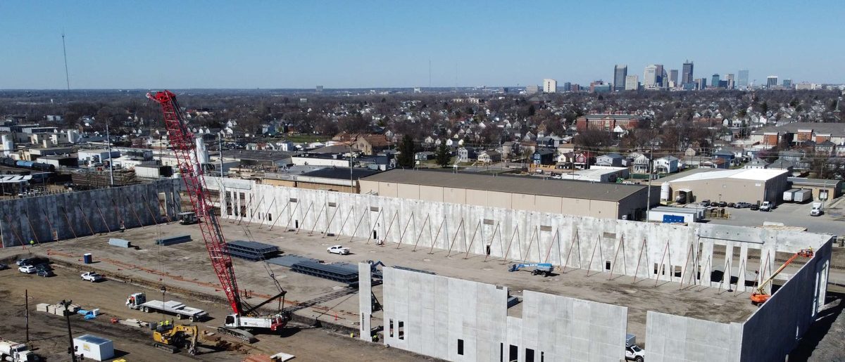Aerial view of a bulk industrial building under construction, representative of the type of bulk and light-industrial assets included in the 38-building Link Logistics portfolio that Stonemont and PCCP acquired from Blackstone in the roughly $1 billion transaction.