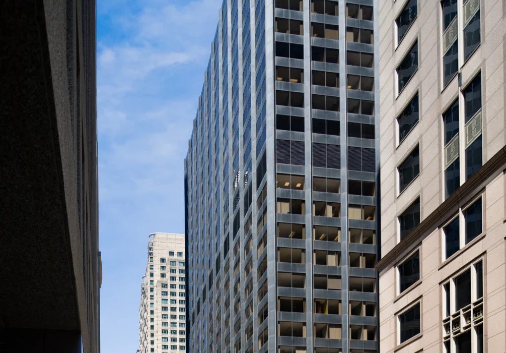 Exterior view of 230 W. Monroe in Chicago’s West Loop, the 29‑story office tower that Stream Realty Partners was recently assigned to manage, expanding the firm’s role there beyond leasing into full property management.
