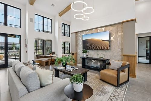 The contemporary resident lounge at Thompson Thrift’s Longmont, Colorado opportunity, one of six multifamily developments targeted through the firm’s 2027 partnership.