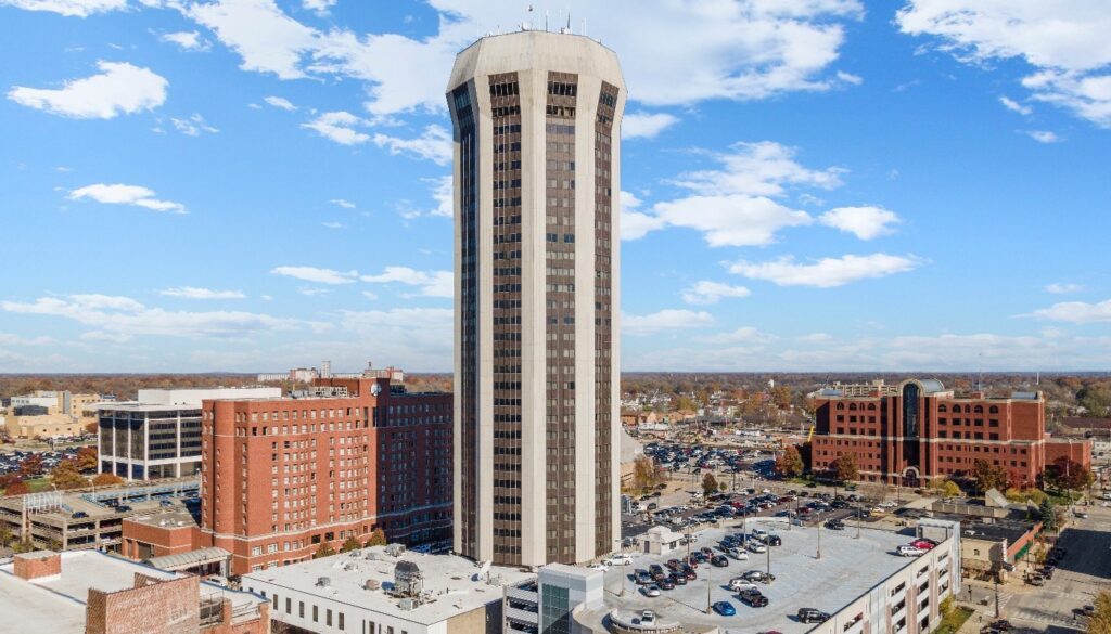Aerial view of the 31-story former Wyndham City Centre at 700 E. Adams Street in downtown Springfield, showing the hotel that Hilco Real Estate is marketing for sale through Tower Capital Group's Chapter 11 process with a September 15, 2026 bid deadline.