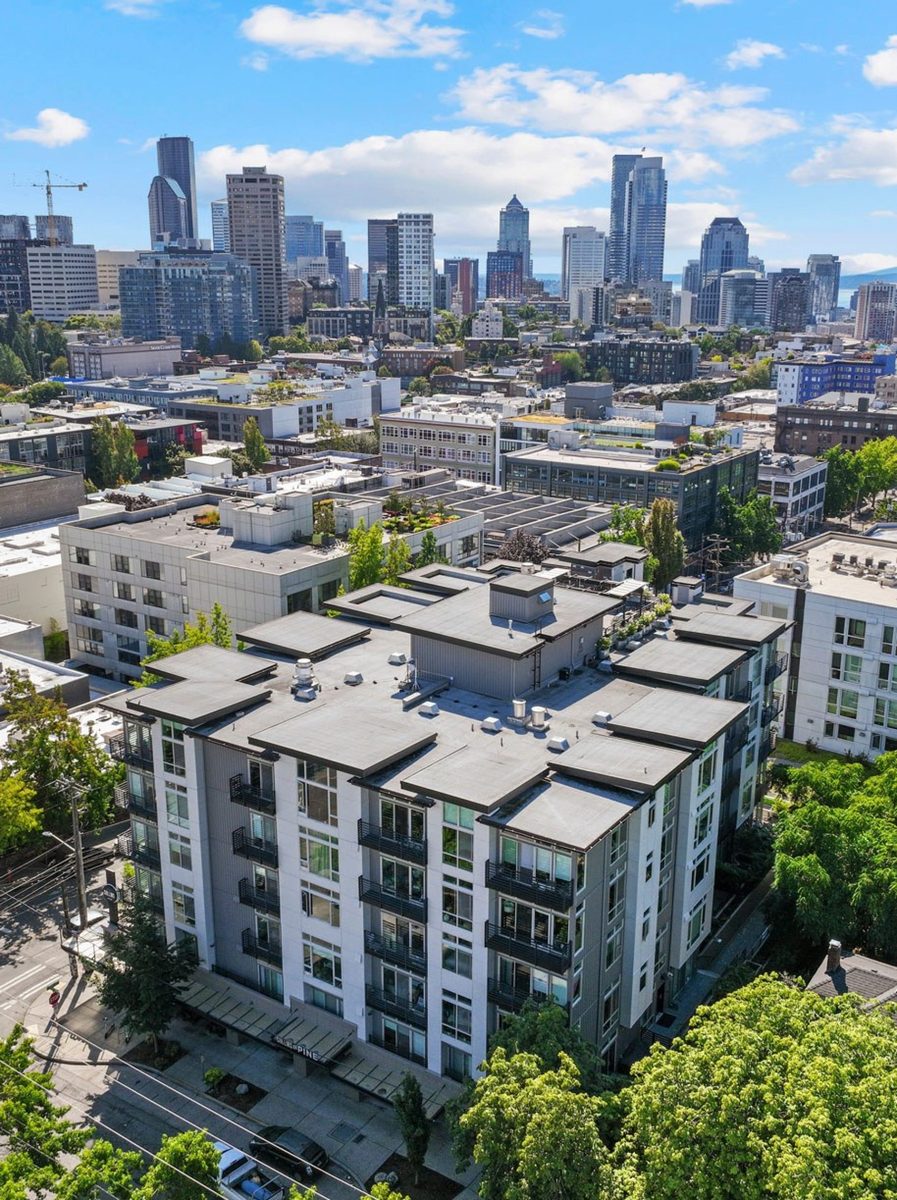 An aerial view of Collins on Pine in Seattle's Capitol Hill neighborhood, the 76-unit mixed-use community acquired by Virtú Investments for a planned value-add renovation.